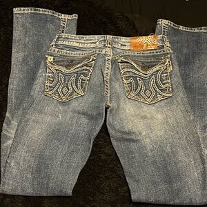 Buckle embellished jeans